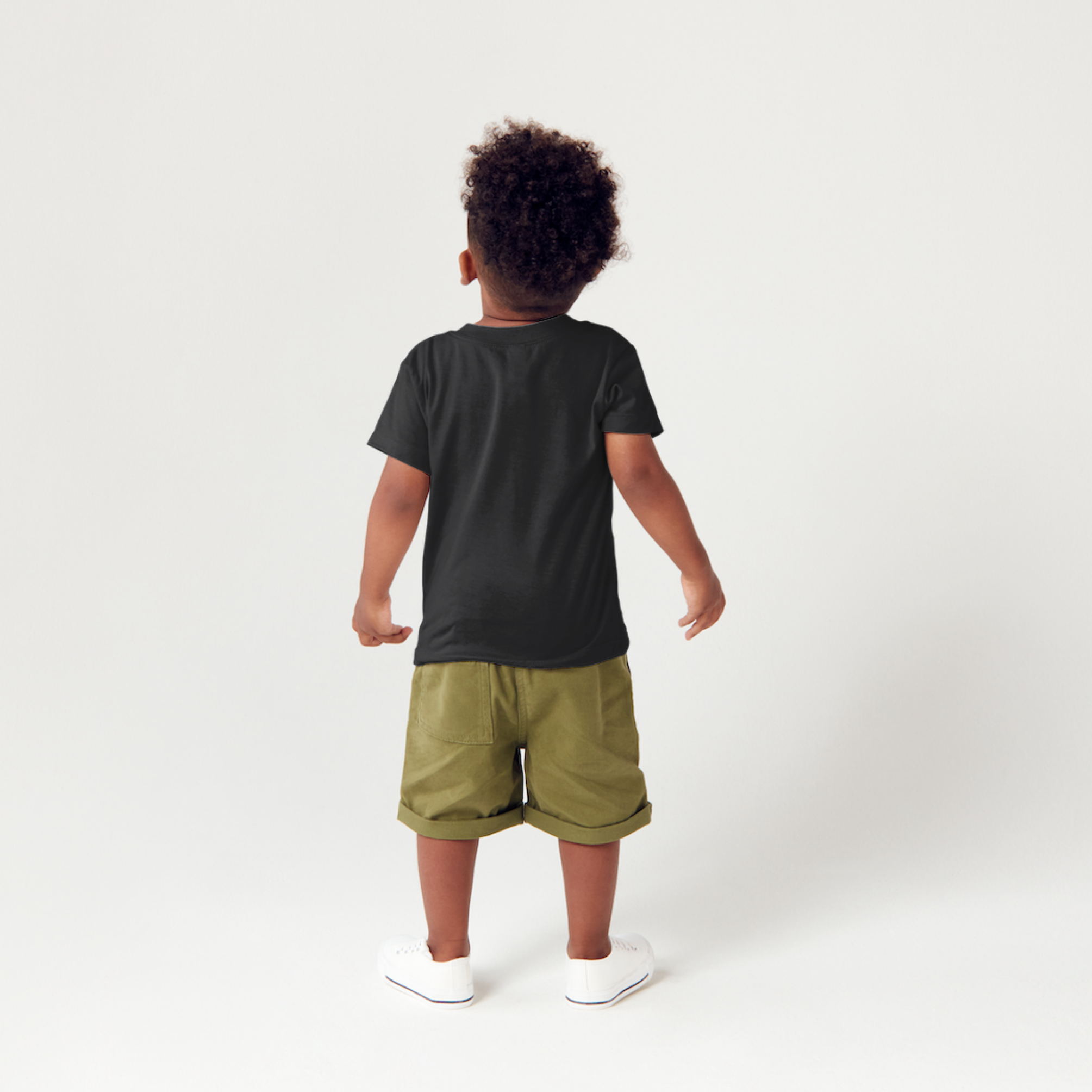 Child wearing a black 2lowsierra 2ls t-shirt and green shorts on a white background