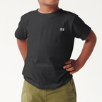 Child wearing a black 2lowsierra 2ls t-shirt and green shorts on a white background