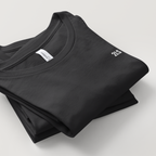 Folded black t-shirt with a brand label on a light gray background 2lowisierra 2LS tshirt