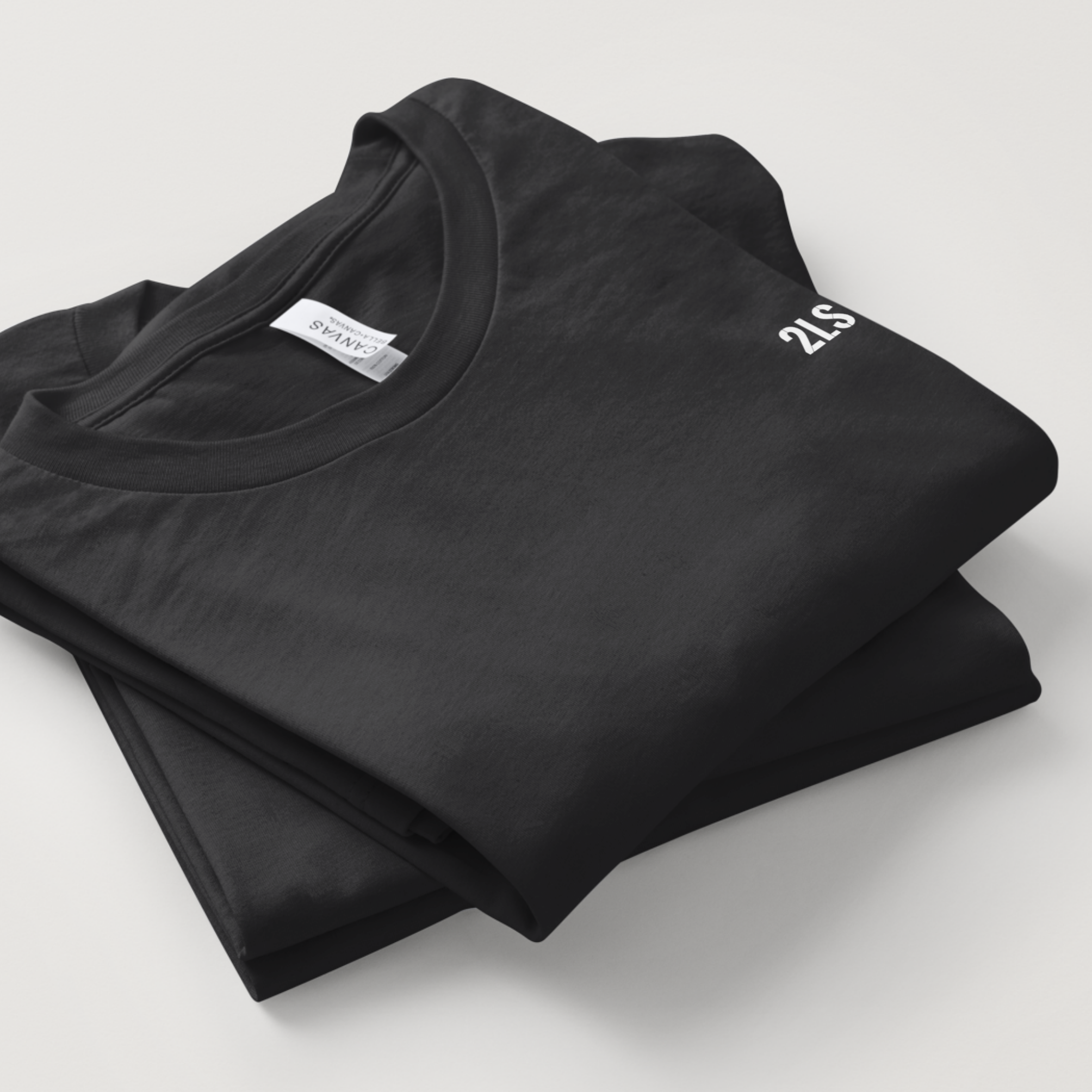 2lowsierra 2LS Folded black t-shirt with a brand label on a light gray background