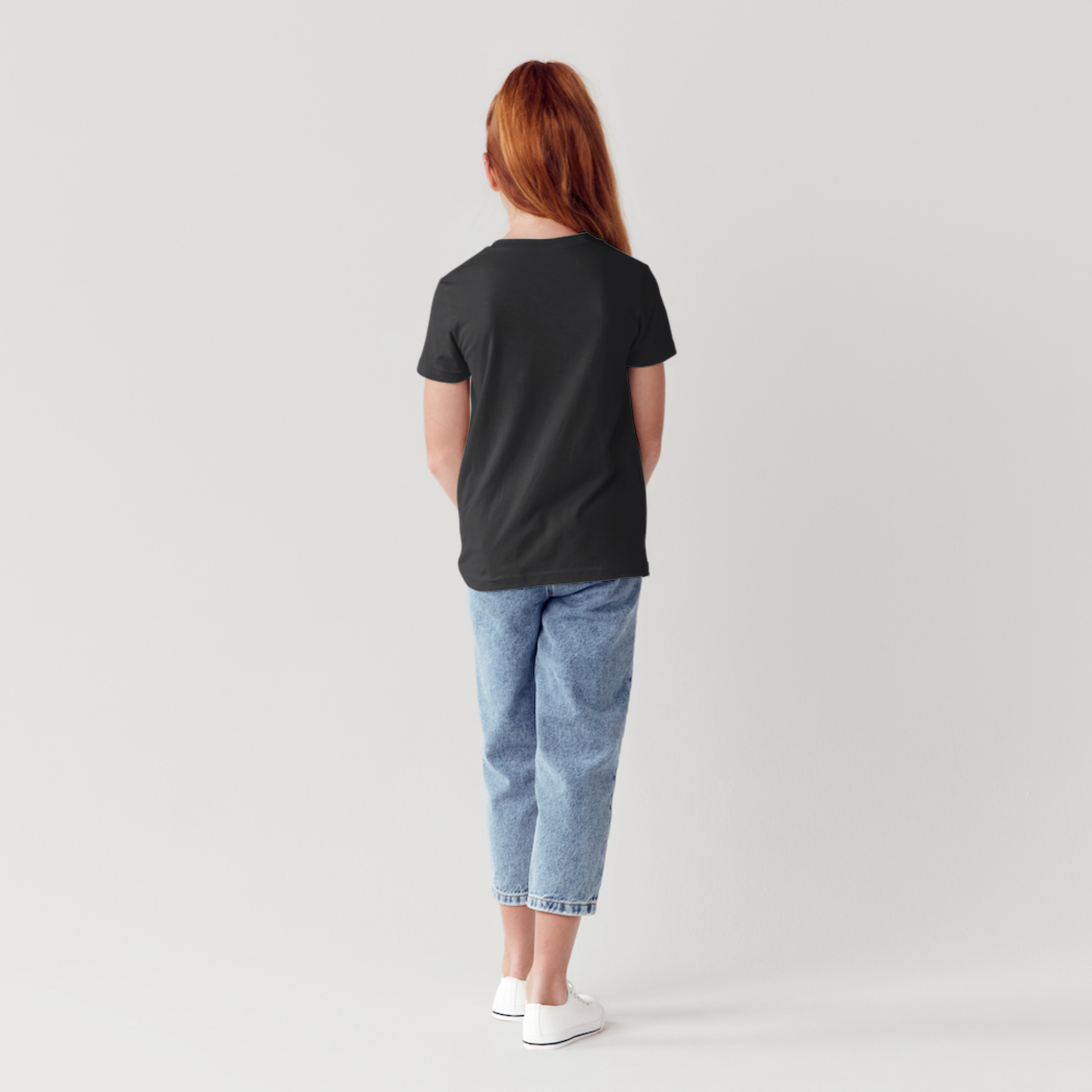 Person wearing a black t-shirt and light blue jeans on a plain background 2ls 2lowsierra